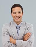 Attractive businessman with folded arms 