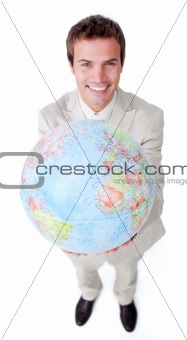 Positive businessman showing a terrestrial globe 