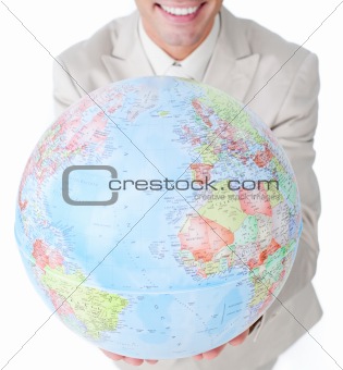 Close-up of a businessman holding a terrestrial globe 