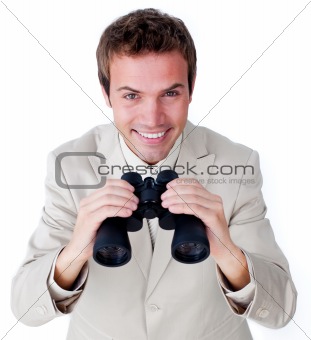 Cheerful businessman looking through binoculars 