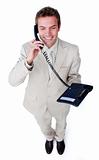 Confident young businessman talking on phone 