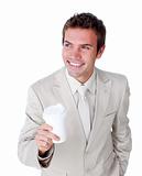 Smiling businessman holding a drinking cup 