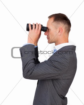 Serious businessman using binoculars