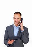 Smiling businessman using a phone 