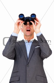 Surprised businessman looking through binoculars 