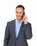 Charismatic attractive businessman using a mobile phone 