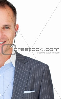 Close-up of a mature businessman with headset on 