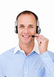 Self-assured mature businessman using headset 