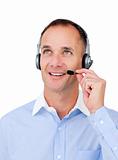Customer service agent with headset on looking upward 