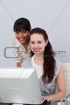 Afro-american businesswoman helping her colleague