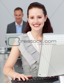 Smiling young businesswoman looking at the camera 