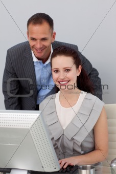 Charming businessman helping his colleague 