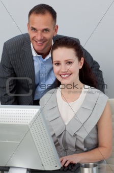 Business partners working at a computer 