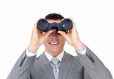 Visionary businessman looking to the future through binoculars 