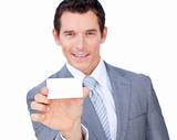 Self-assured caucasian businessman showing a white card