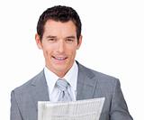 Smiling businessman reading a newspaper 