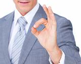 Close-up of a businessman showing OK sign 