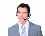 Smiling attractive businessman using headset 