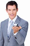 Smiling businessman holding a service bell 