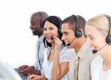 Brunette businesswoman and her team working in a call center