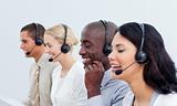 Laughing business people working in a call center