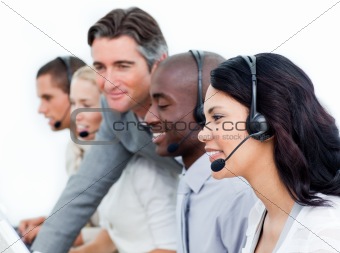 Charismatic manager and his team working in a call center