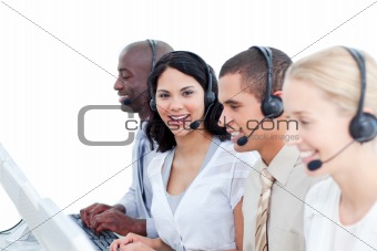 Brunette woman and her team working in a call center