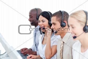 Laughing woman and her team working in a call center