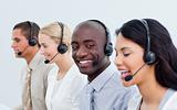 Ethnic man and his team working in a call center