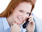 Positive businesswoman taling on phone