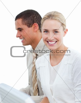 Portrait of a blond business woman and her colleague at work