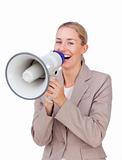 Laughing businesswoman shouting through a megaphone