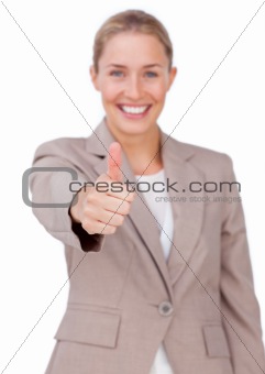 Successful businesswoman with thumb up 