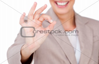 Close-up of a businesswoman showing OK sign 