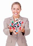 Smiling businesswoman holding a molecule 