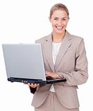 Assertive businesswoman using a laptop 