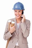 Charming female architect on phone standing 