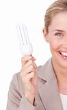 Close-up of a businesswoman holding a saving energy light bulb 