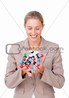 Confident businesswoman looking at a molecule 