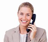 Close-up of a positive blond businesswoman on phone 