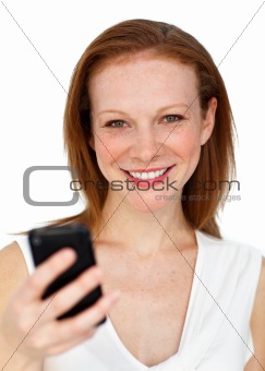 Attractive businesswoman sending a text