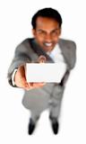 Smiling ethnic businessman holding a white card 