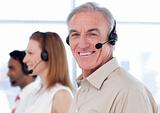 Smiling business manager in a call center