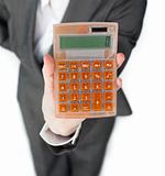 Close-up of a businesswoman holding a calculator 