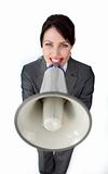 Positive businesswoman using a megaphone 