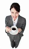 Sparkling businesswoman drinking a cup of coffee 