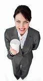 Attractive businesswoman holding a drinking cup 