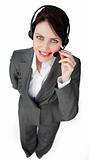 Self-assured businesswoman talking on a headset 