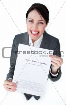 Radiant businesswoman showing a legal document