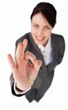 Successful businesswoman showing OK sign 
